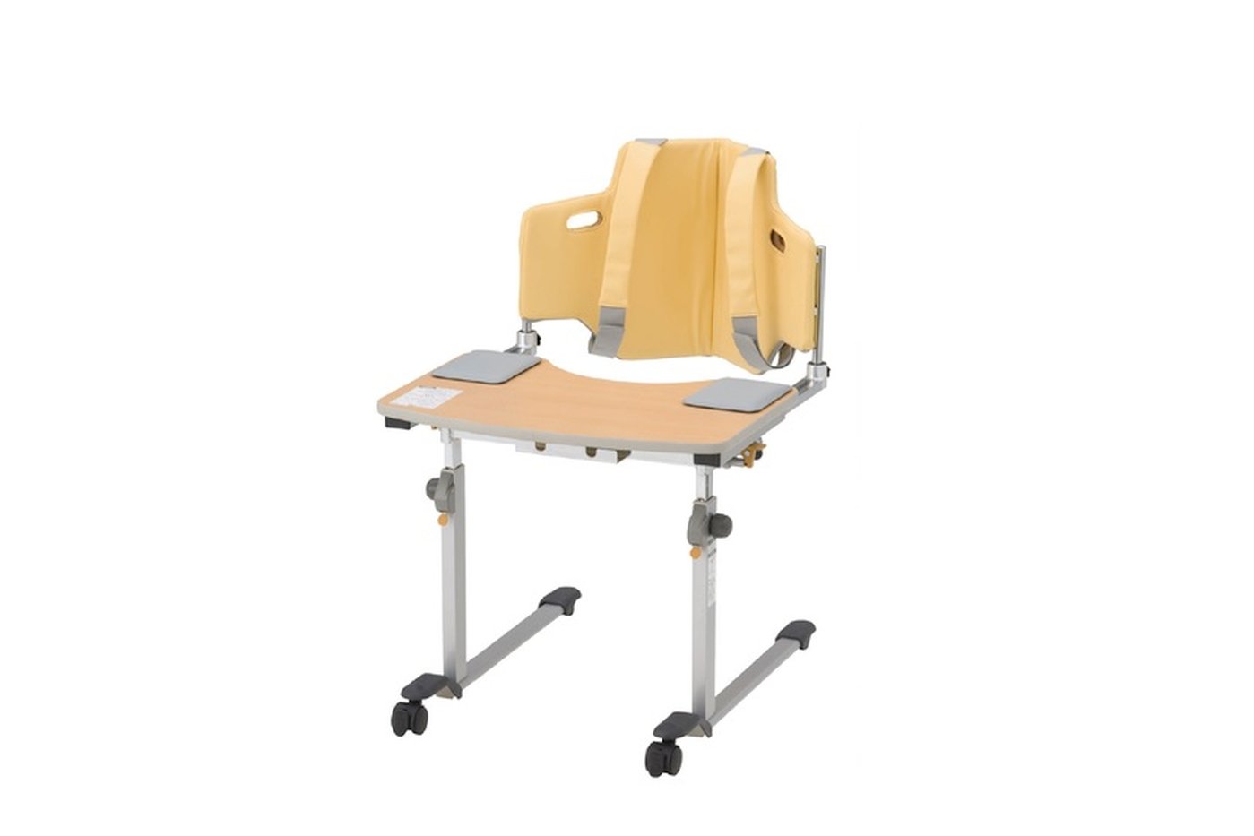 Sittan Rehab Table with table top in melamine-faced particle board in colour of maple, back cushion and support belts in yellow, height and depth adjustable table on steel legs with 2 front caster wheels, and 2 elbow pads in grey on each side of the table top.
