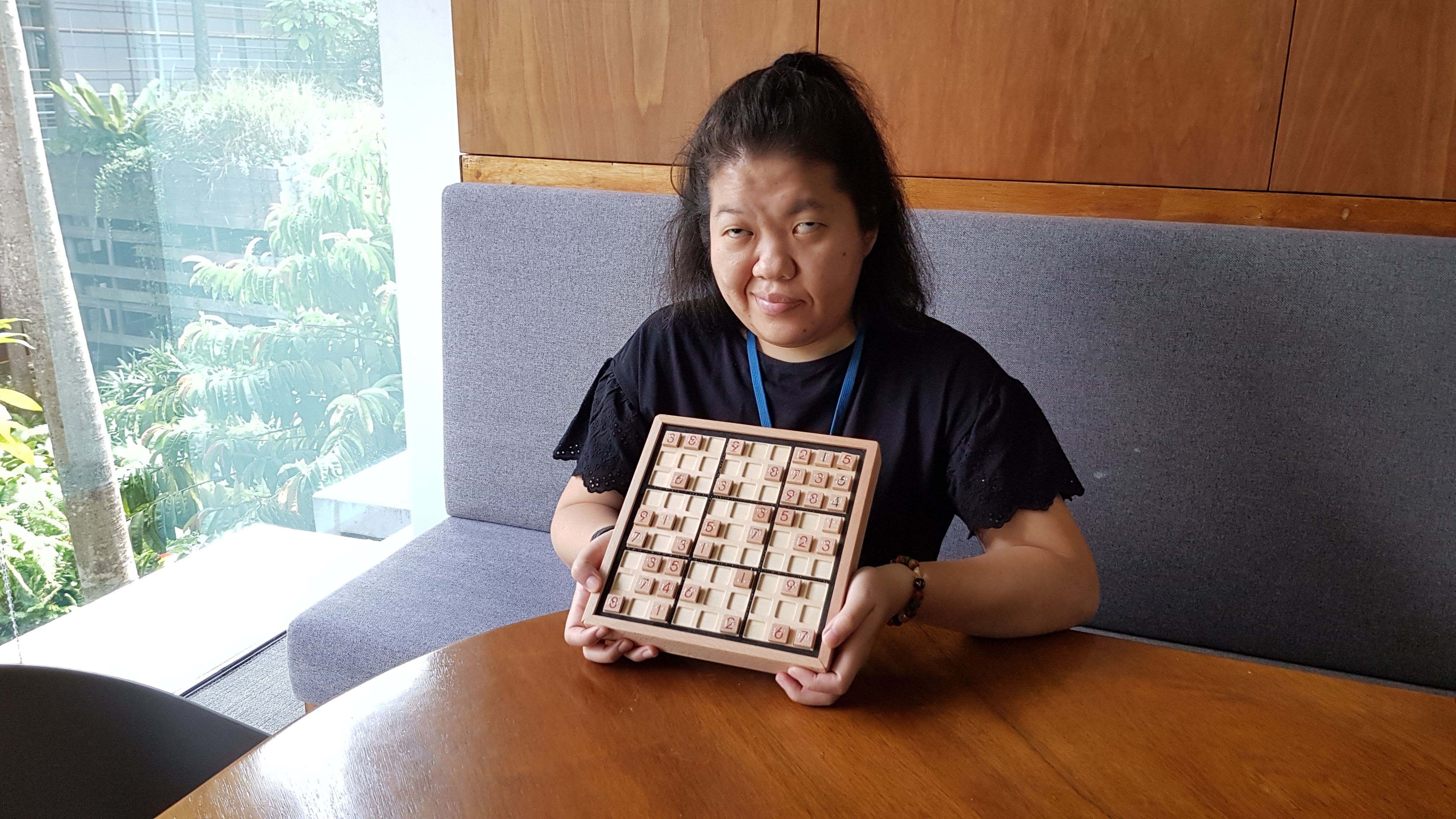 Siew Ling posing with her adapted Sudoku set.